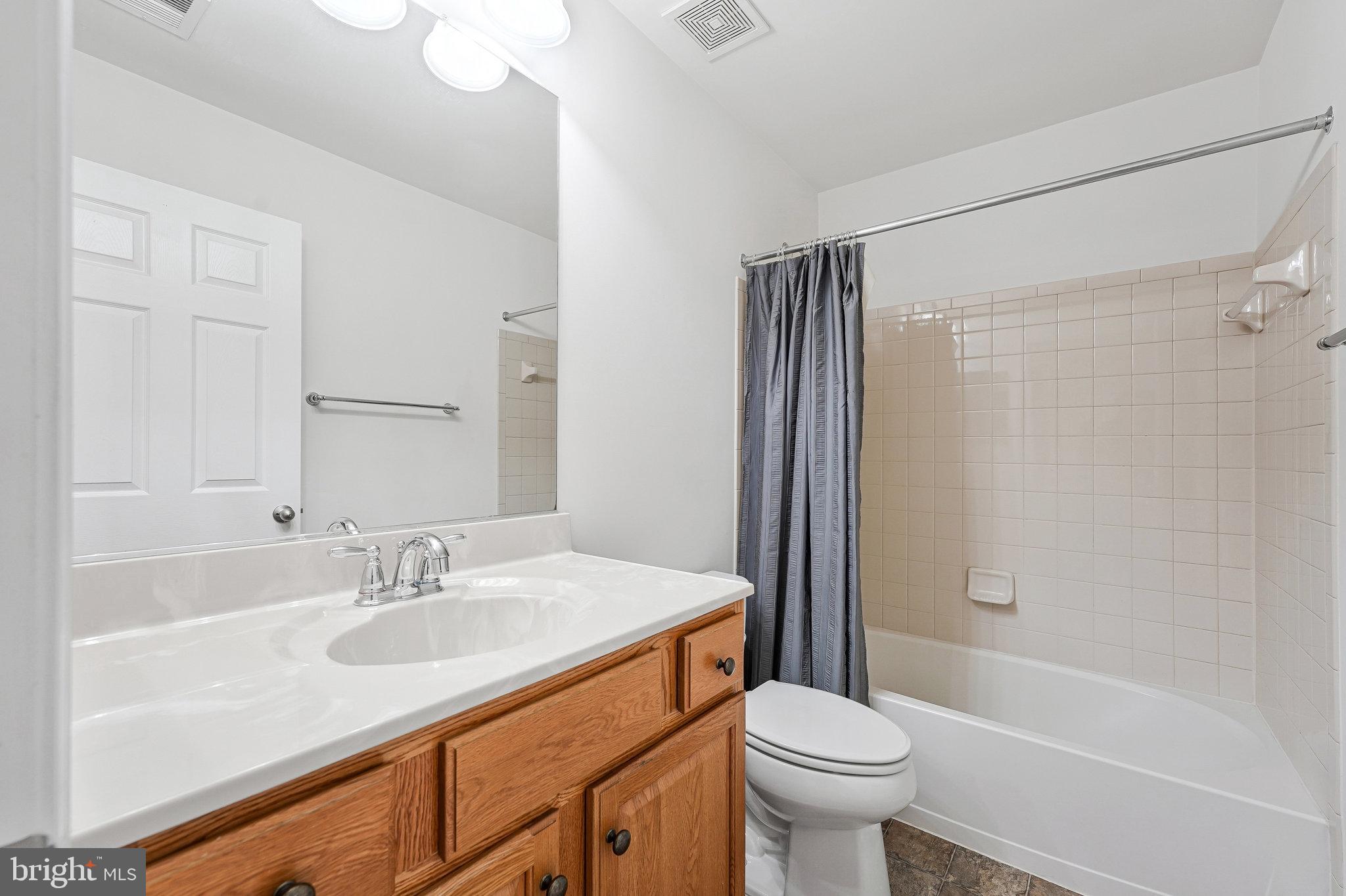 16012 Imperial Eagle Court Woodbridge, VA 22191 - Photo 19 of 25 a bathroom with a sink toilet and shower