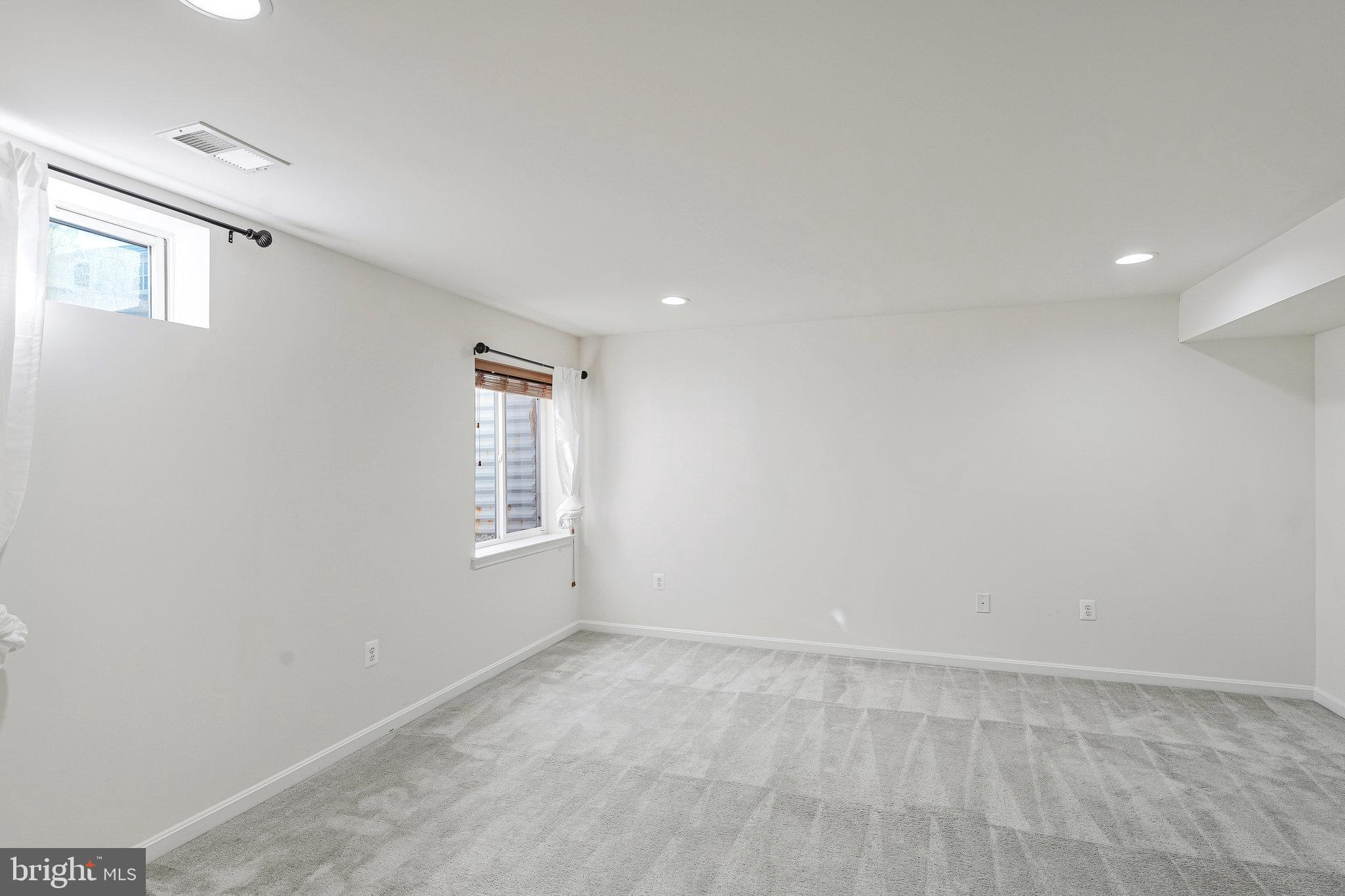 16012 Imperial Eagle Court Woodbridge, VA 22191 - Photo 22 of 25 an empty room with windows