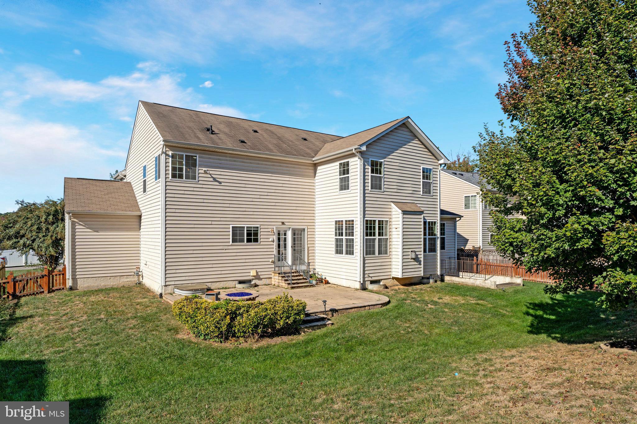 16012 Imperial Eagle Court Woodbridge, VA 22191 - Photo 24 of 25 a front view of a house with a yard and garage