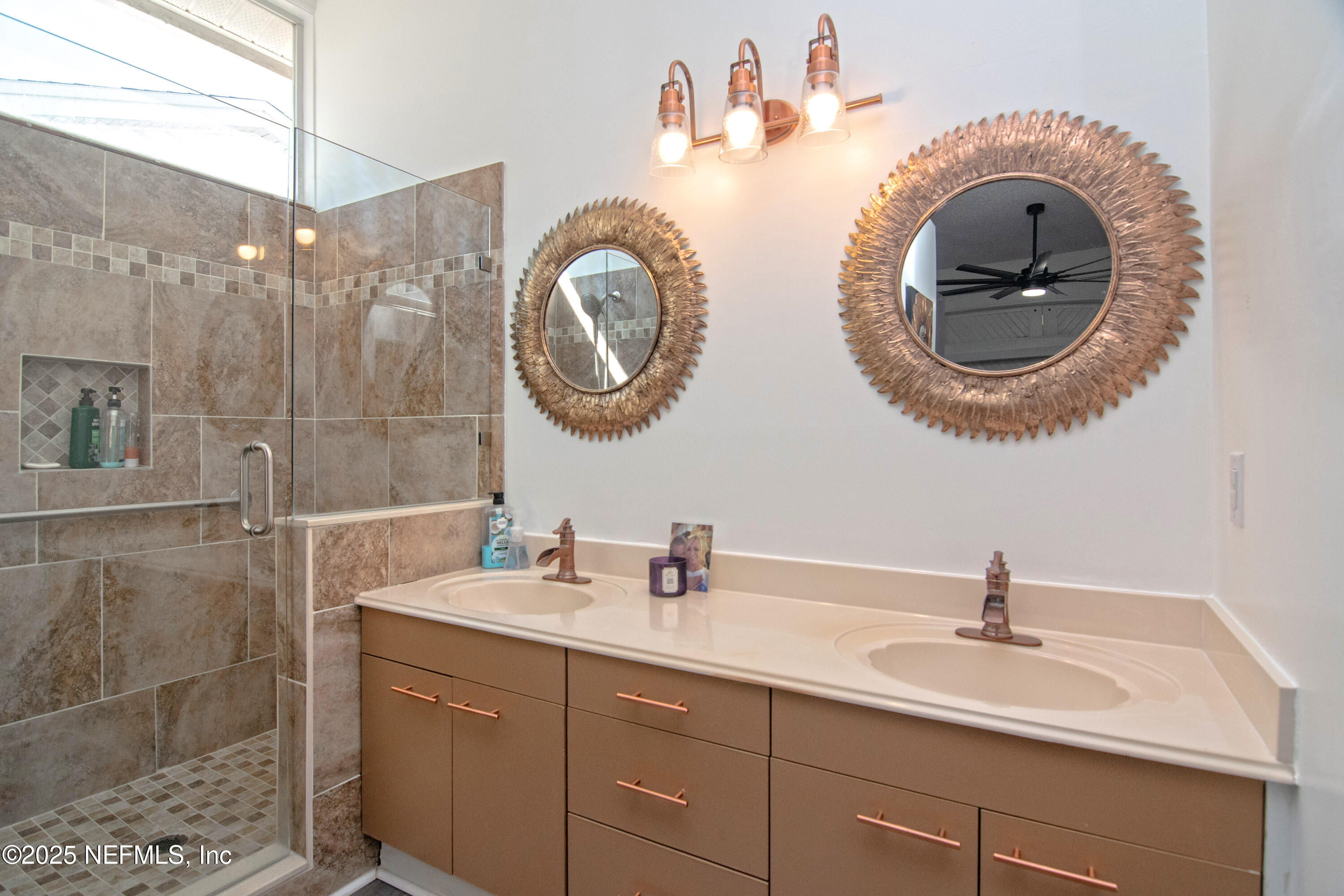 358 Monika Place St. Augustine, FL 32080 - Photo 12 of 32 a bathroom with a sink and a mirror