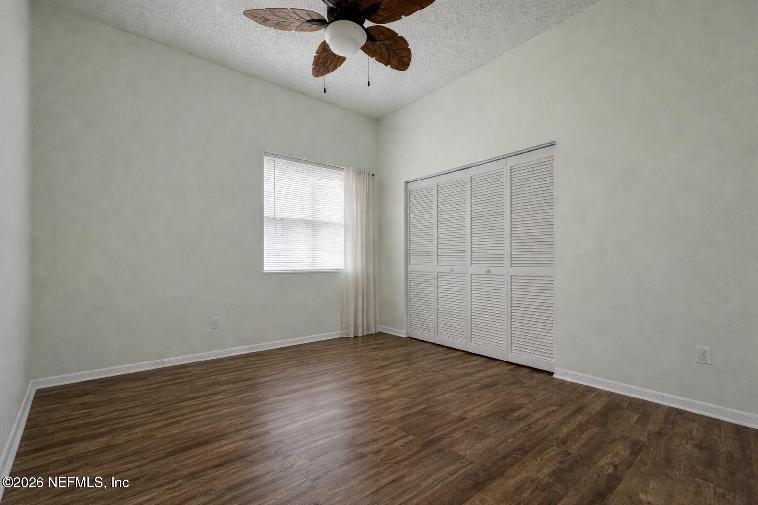 358 Monika Place St. Augustine, FL 32080 - Photo 25 of 41 a view of an empty room with wooden floor and a window