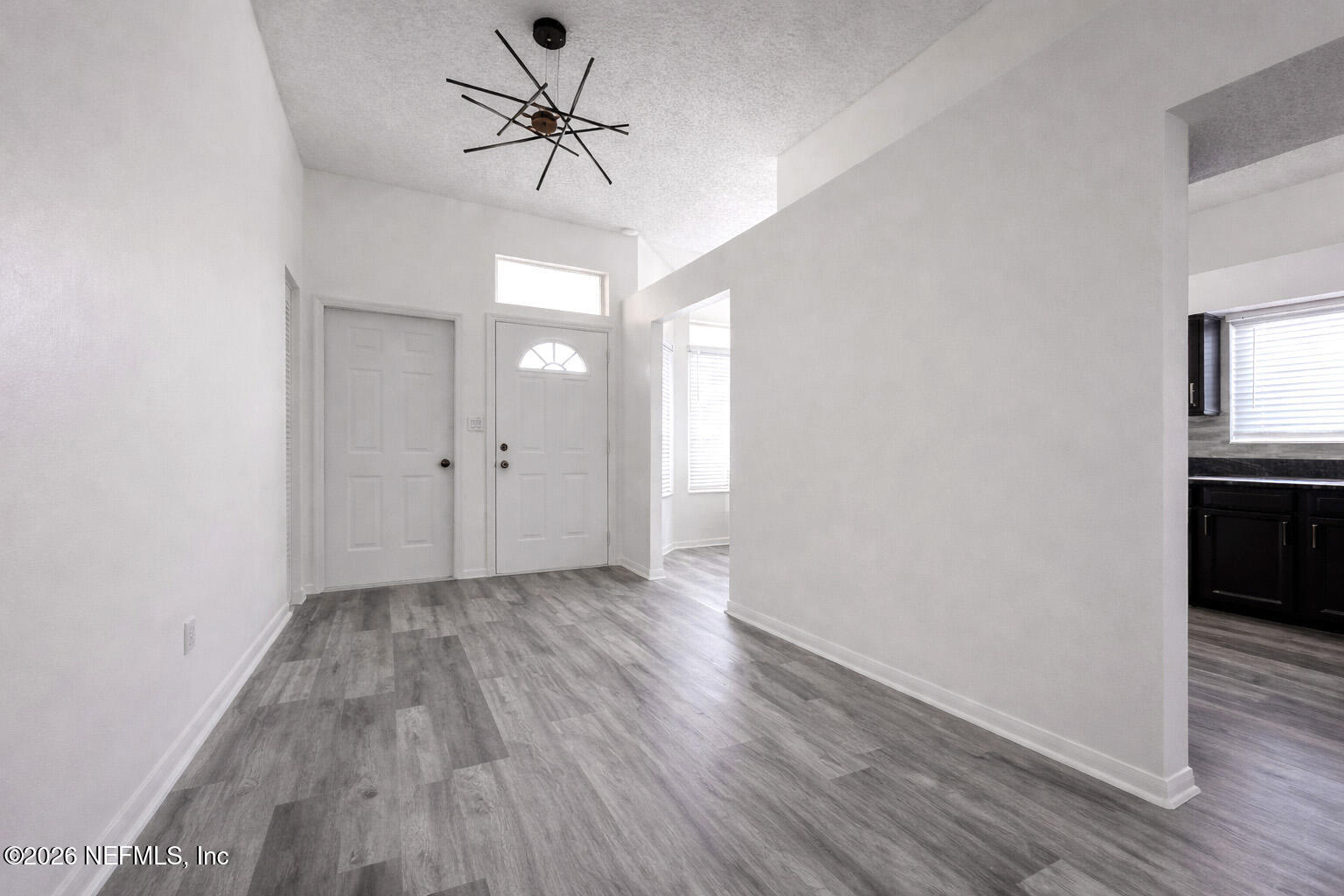 358 Monika Place St. Augustine, FL 32080 - Photo 7 of 41 wooden floor in an empty room with a window