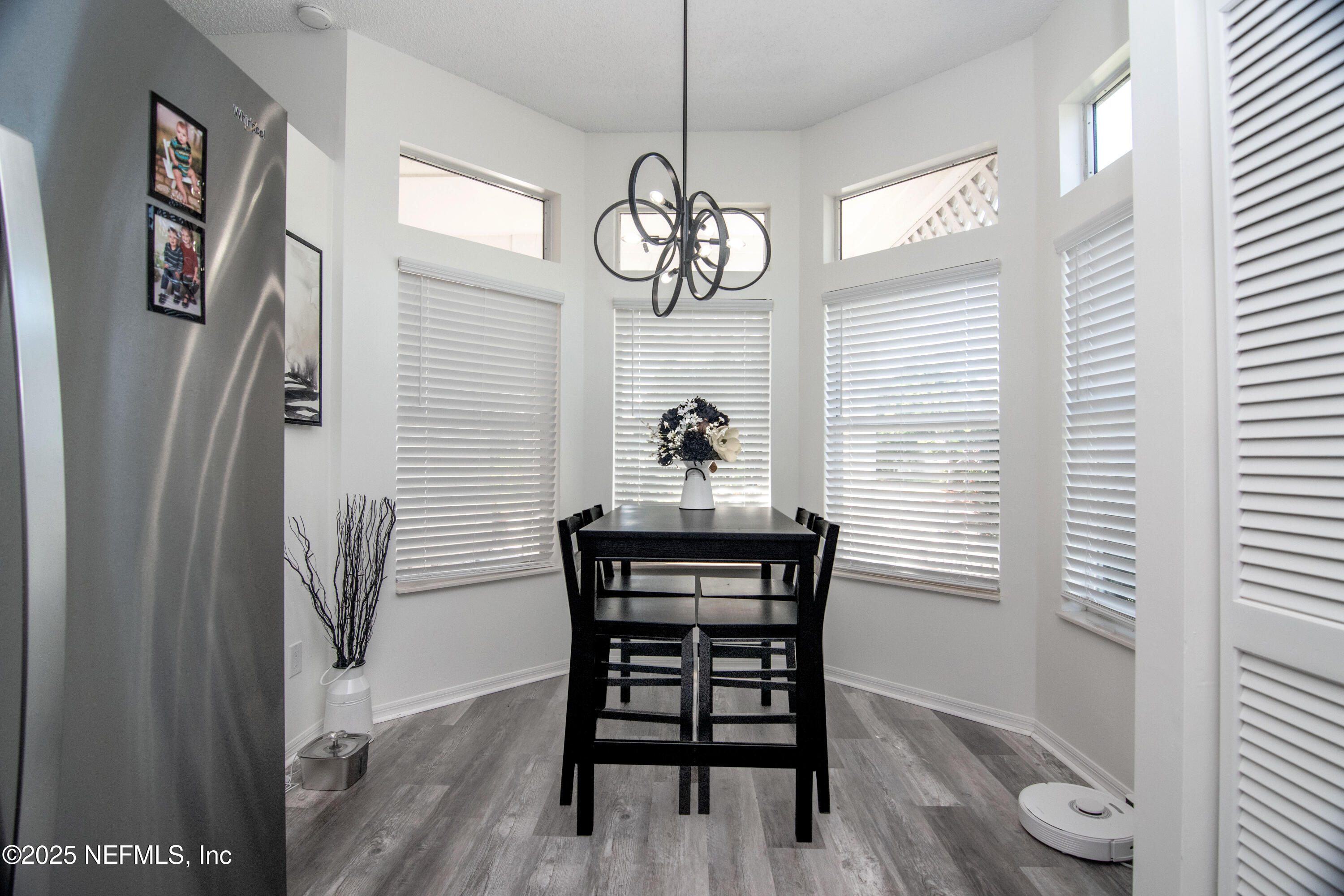 358 Monika Place St. Augustine, FL 32080 - Photo 9 of 32 a view of a dining room with furniture window and wooden floor