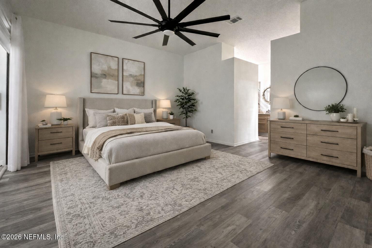 358 Monika Place St. Augustine, FL 32080 - Photo 10 of 41 a bedroom with a bed a mirror and a potted plant