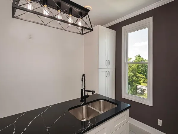a bathroom with a sink and a window