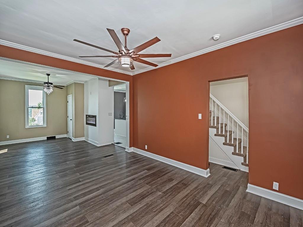 1741 Freeport Road New Kensington, PA 15068 - Photo 3 of 28 a view of an empty room with wooden floor and a ceiling fan