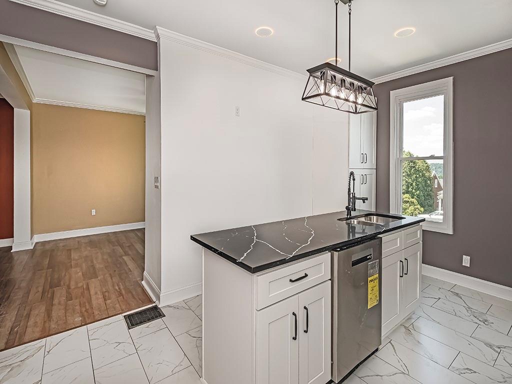 1741 Freeport Road New Kensington, PA 15068 - Photo 10 of 28 a kitchen with granite countertop a sink and a stove