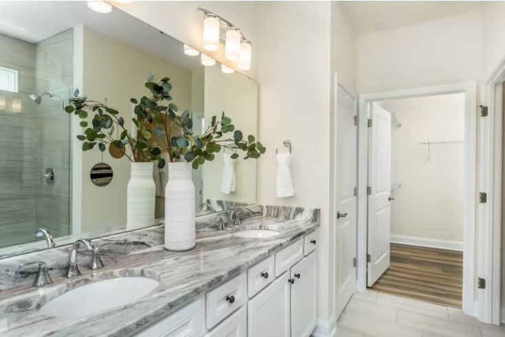 428 Yellowstone Road Lebanon, TN 37090 - Photo 9 of 25 a bathroom with a granite countertop sink a mirror and a shower