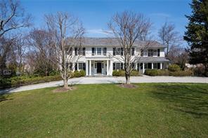 a front view of a building with a garden