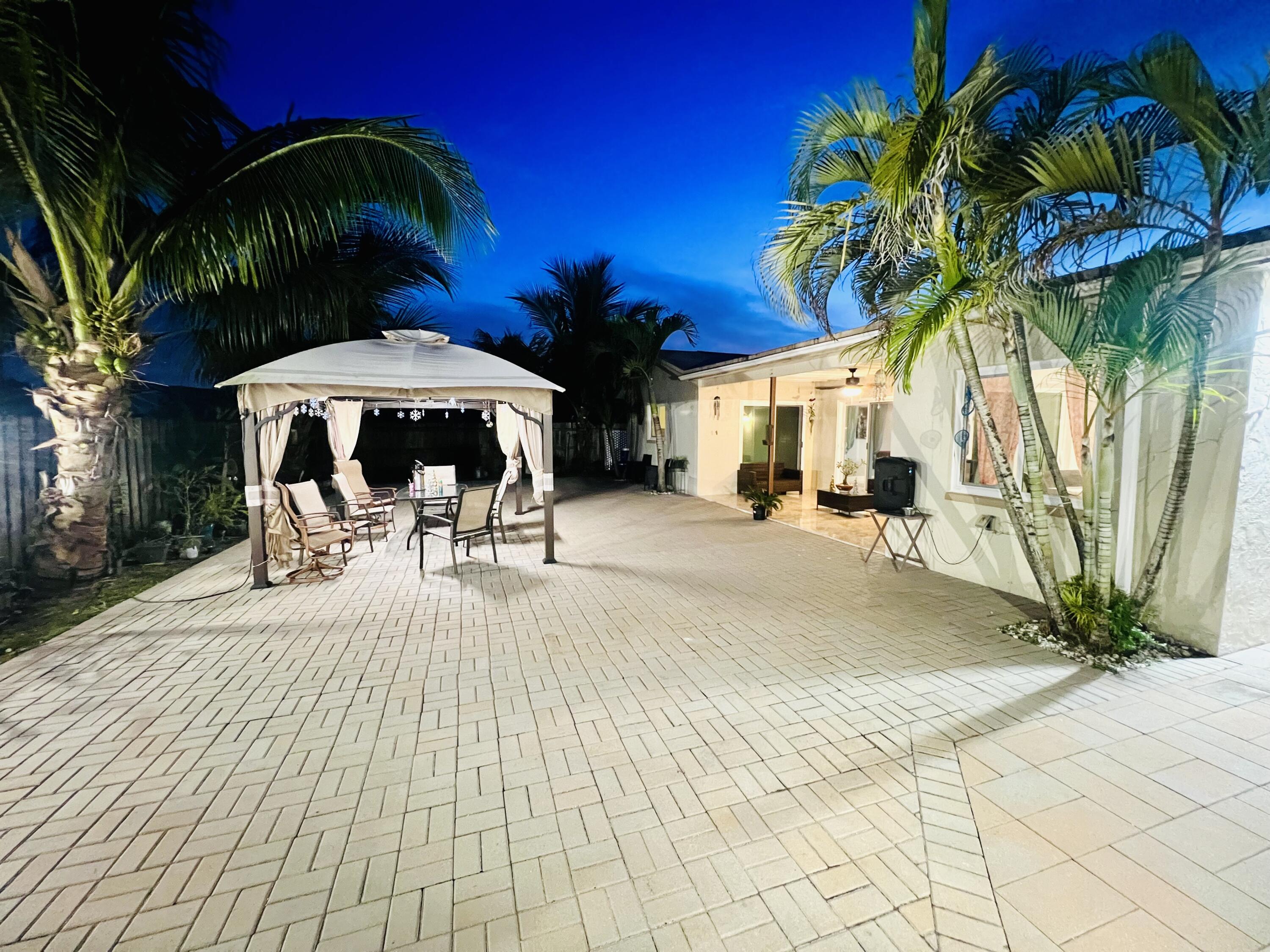 22744 Southwest 54th Way Boca Raton, FL 33433 - Photo 3 of 72 a view of a backyard with a sitting area