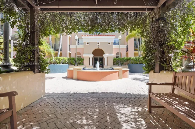 a room with furniture pool table and windows