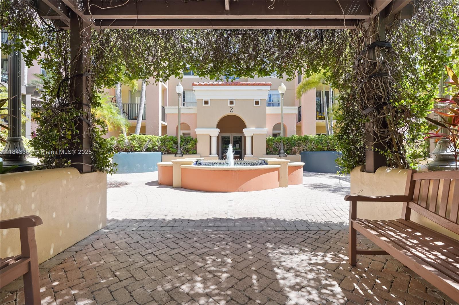 520 Southeast 5th Avenue, Unit 3503 Fort Lauderdale, FL 33301 - Photo 15 of 37 a view of a fountain with a bench in patio