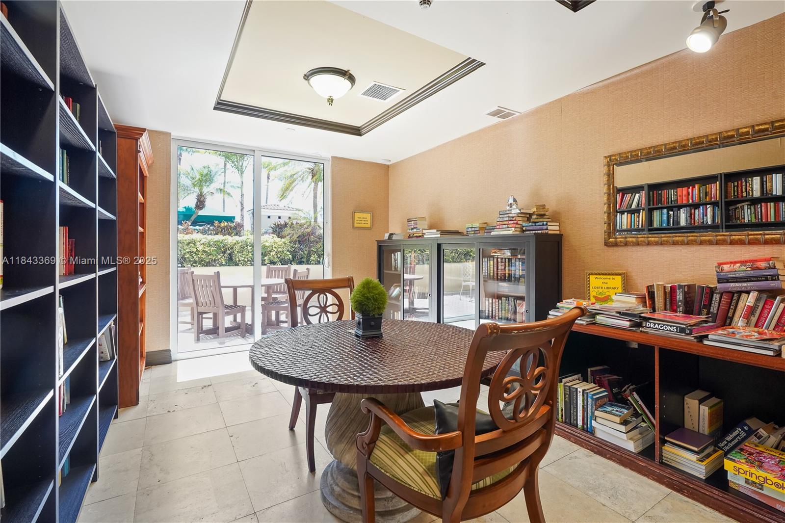 520 Southeast 5th Avenue, Unit 3503 Fort Lauderdale, FL 33301 - Photo 21 of 37 a view of a livingroom with furniture and a bookshelf