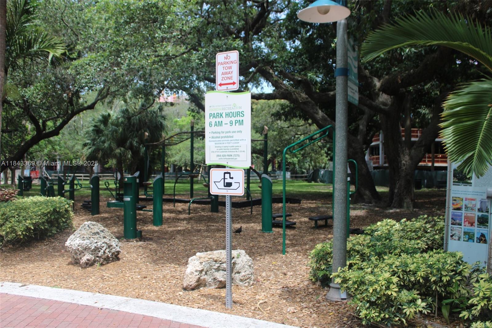 520 Southeast 5th Avenue, Unit 3503 Fort Lauderdale, FL 33301 - Photo 30 of 37 a sign board with a house and trees in the background