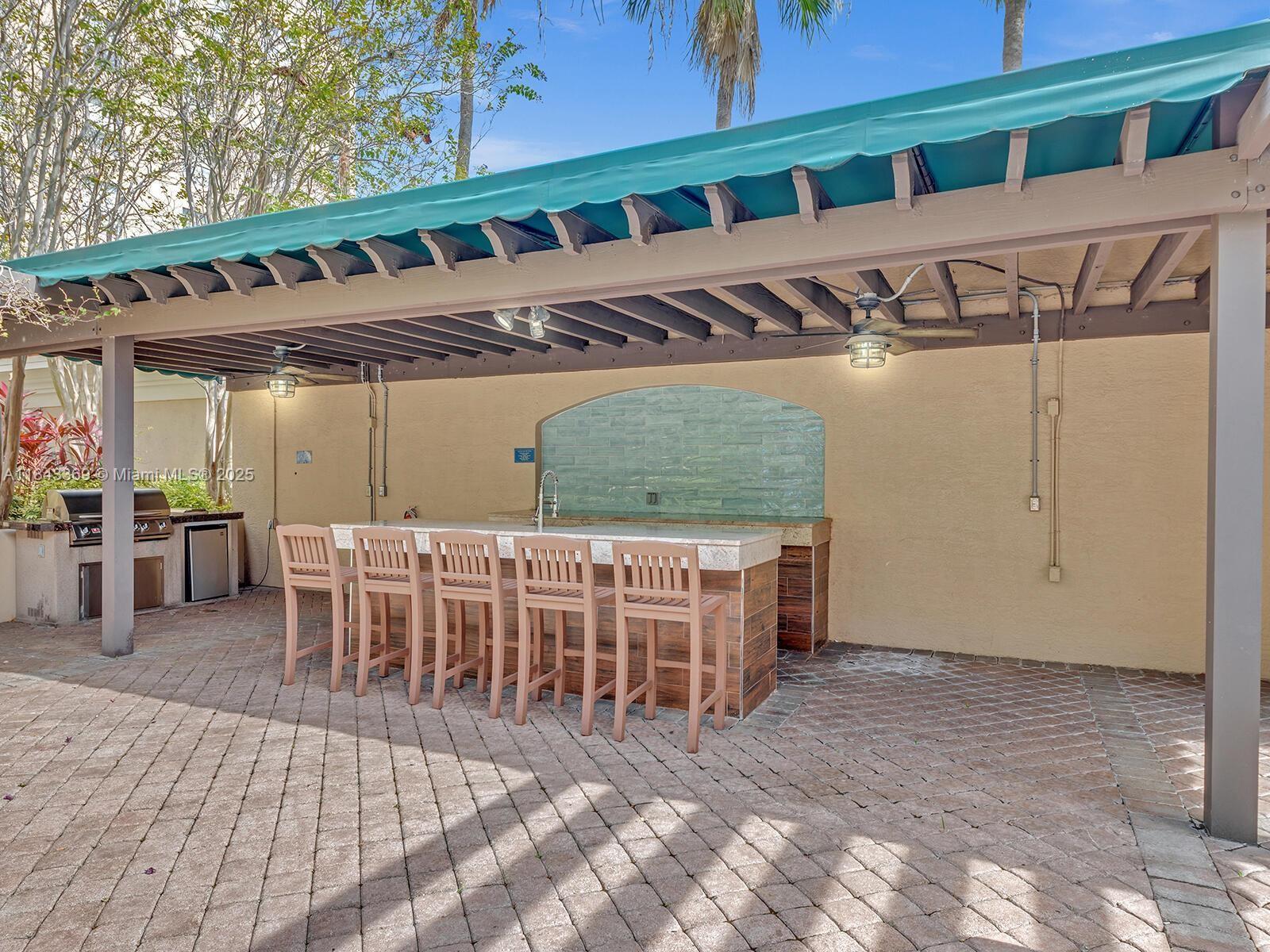 520 Southeast 5th Avenue, Unit 3503 Fort Lauderdale, FL 33301 - Photo 7 of 37 a view of a chairs and table in patio