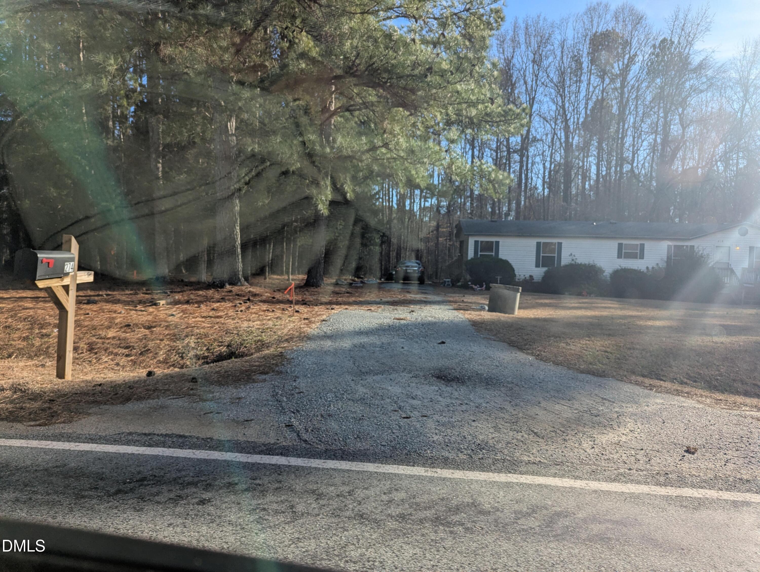 4 Plum Nutty Road Henderson, NC 27537 - Photo 2 of 2 a view of a yard with large trees