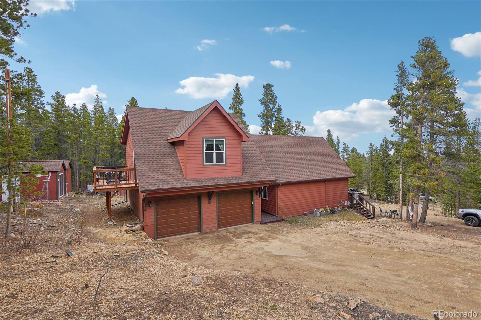 125 Aspen Road Black Hawk, CO 80422 - Photo 42 of 44 a view of a house with a yard and garage