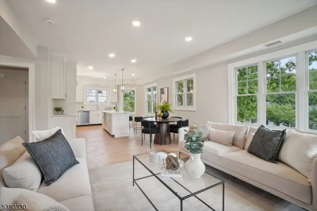 a kitchen with refrigerator cabinets dining table and chairs