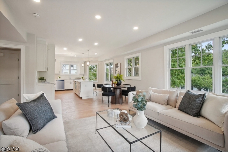 603 Springfield Avenue, Unit 104 Summit, NJ 07901 - Photo 3 of 6 a living room with furniture and a large window