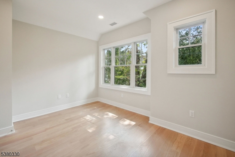 603 Springfield Avenue, Unit 104 Summit, NJ 07901 - Photo 5 of 6 an empty room with a window