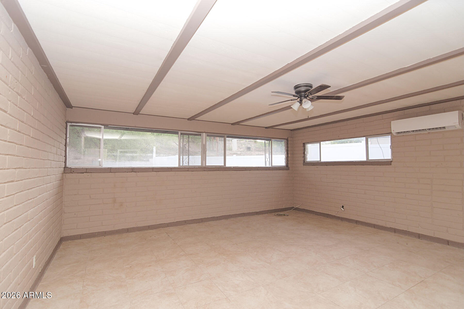 1176 North Royal Road Nogales, AZ 85621 - Photo 6 of 10 an empty room with windows