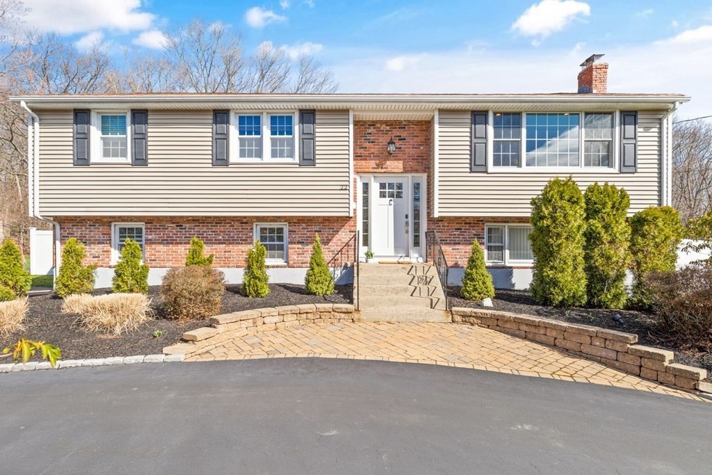 22 Kennedy Road Sharon, MA 02067 - Photo 1 of 41 a front view of a house with a yard and potted plants