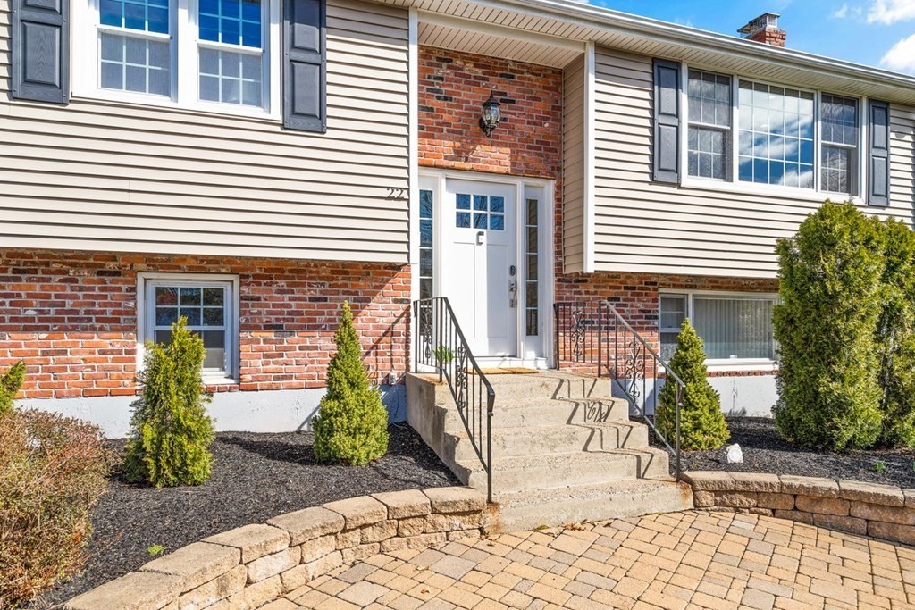 22 Kennedy Road Sharon, MA 02067 - Photo 2 of 41 a front view of a house with a yard