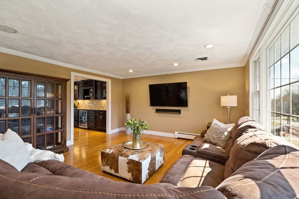 22 Kennedy Road Sharon, MA 02067 - Photo 6 of 41 a living room with furniture and a flat screen tv
