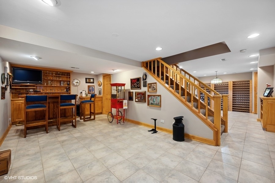 1612 Stonebridge Trail Wheaton, IL 60189 - Photo 16 of 22 a view of a livingroom with furniture and staircase