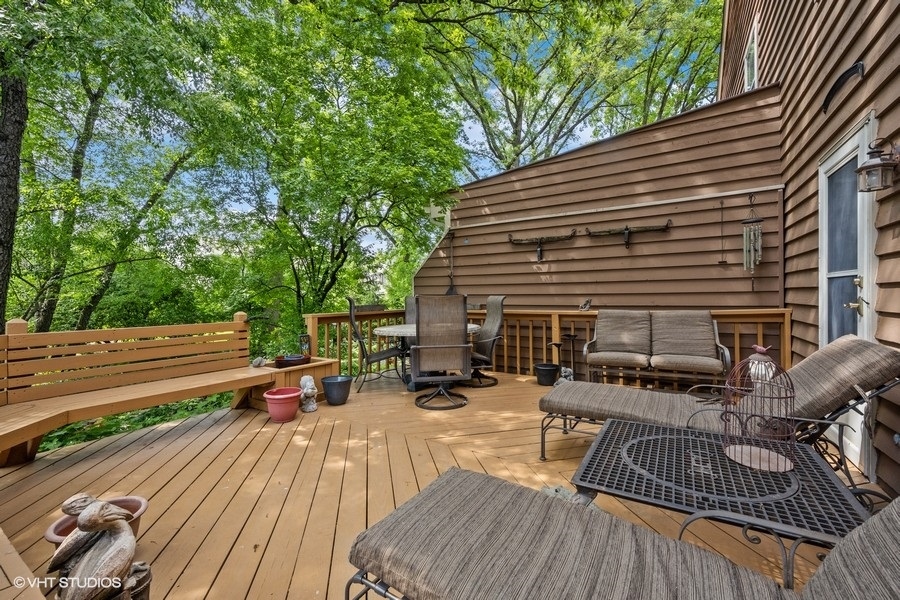 1612 Stonebridge Trail Wheaton, IL 60189 - Photo 18 of 22 a view of backyard with seating space and trees