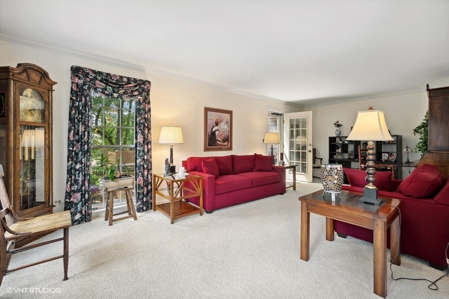 1612 Stonebridge Trail Wheaton, IL 60189 - Photo 2 of 22 a living room with furniture and a fireplace