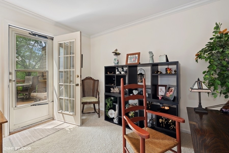 1612 Stonebridge Trail Wheaton, IL 60189 - Photo 3 of 22 a view of a workspace with furniture and entryway
