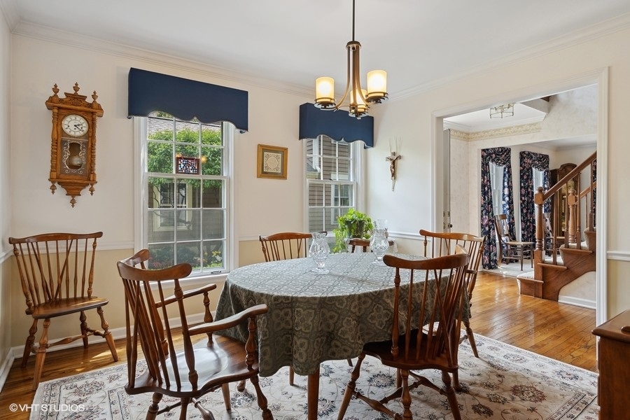 1612 Stonebridge Trail Wheaton, IL 60189 - Photo 5 of 22 a view of a dining room with furniture window and wooden floor