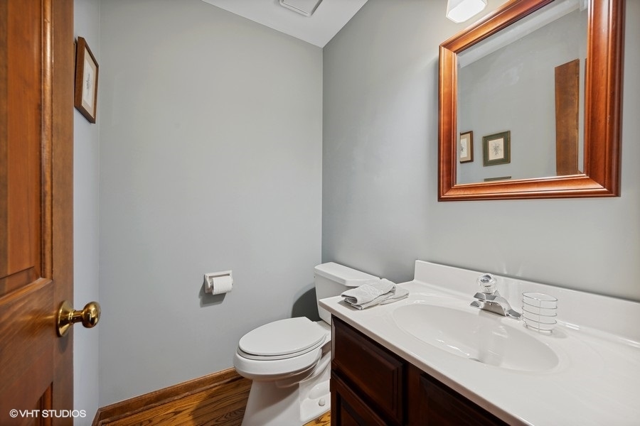 1612 Stonebridge Trail Wheaton, IL 60189 - Photo 6 of 22 a bathroom with a sink and a toilet