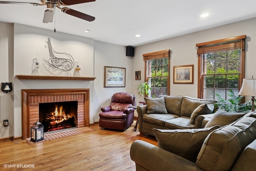 1612 Stonebridge Trail Wheaton, IL 60189 - Photo 9 of 22 a living room with furniture and a fireplace