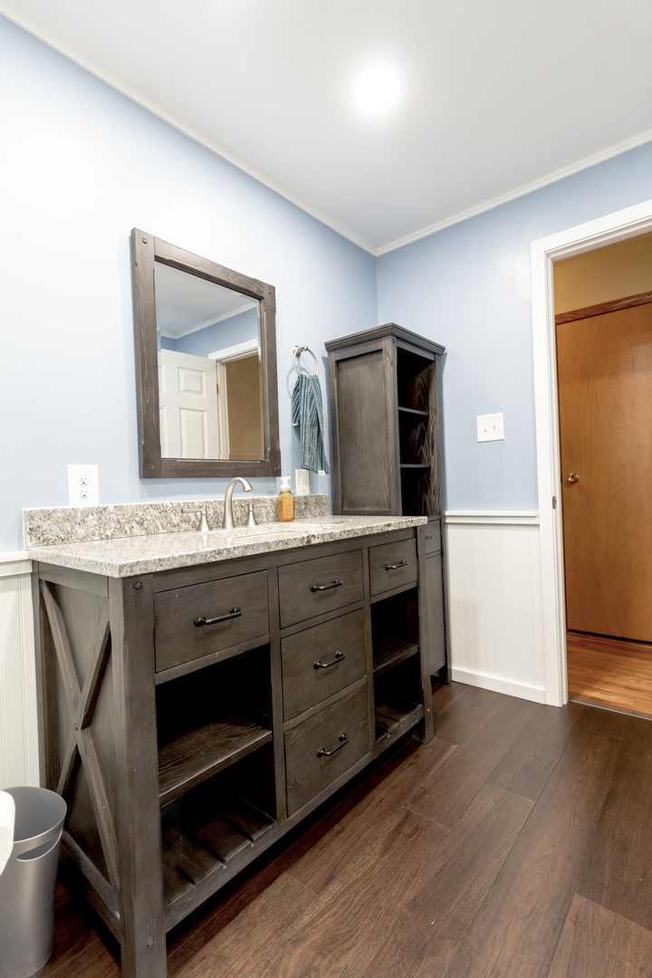 1455 North Gorham Road Morris, IL 60450 - Photo 16 of 22 a bathroom with a granite countertop sink and a mirror