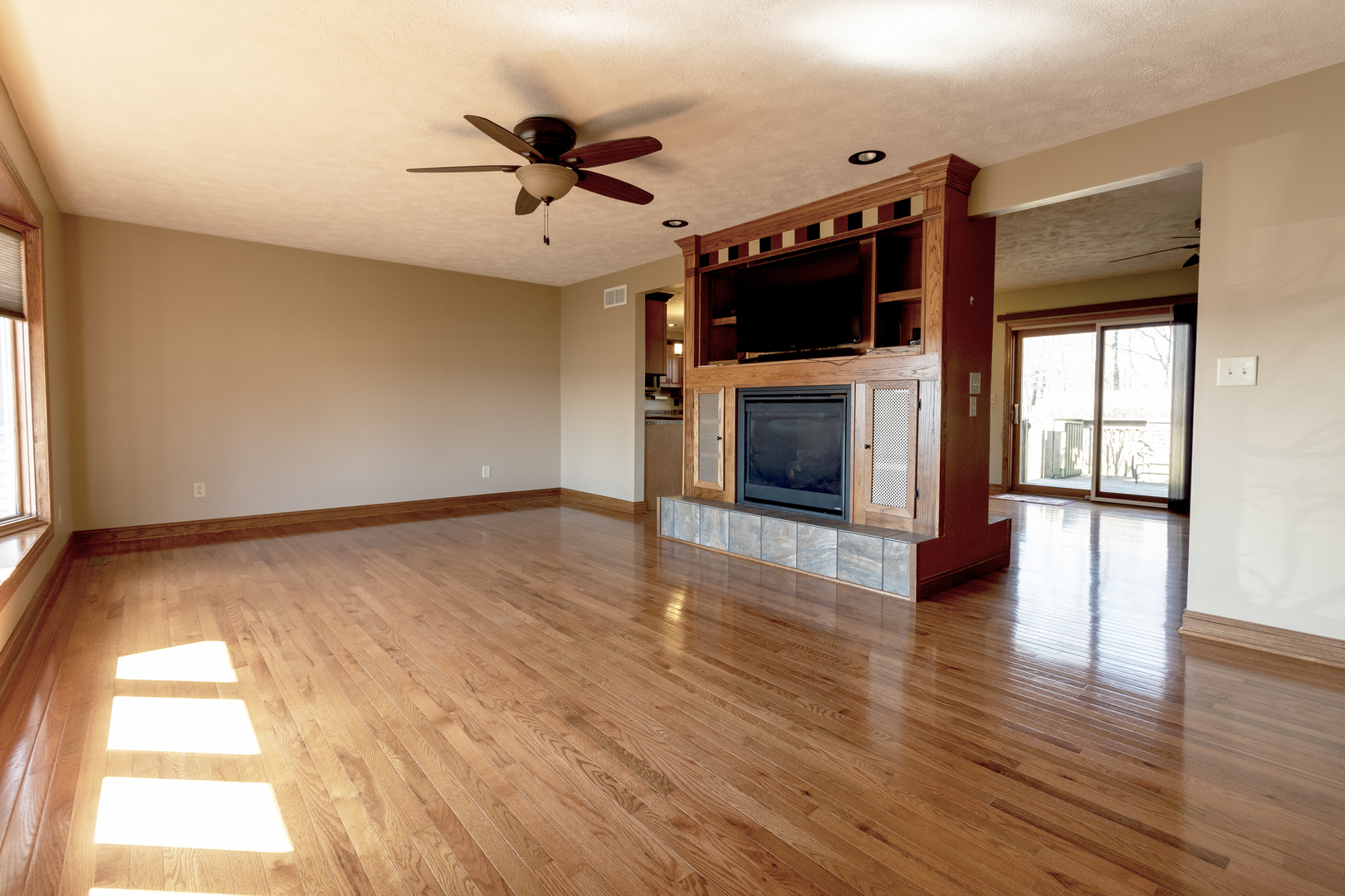 1455 North Gorham Road Morris, IL 60450 - Photo 2 of 22 a view of an empty room with a fireplace and a window