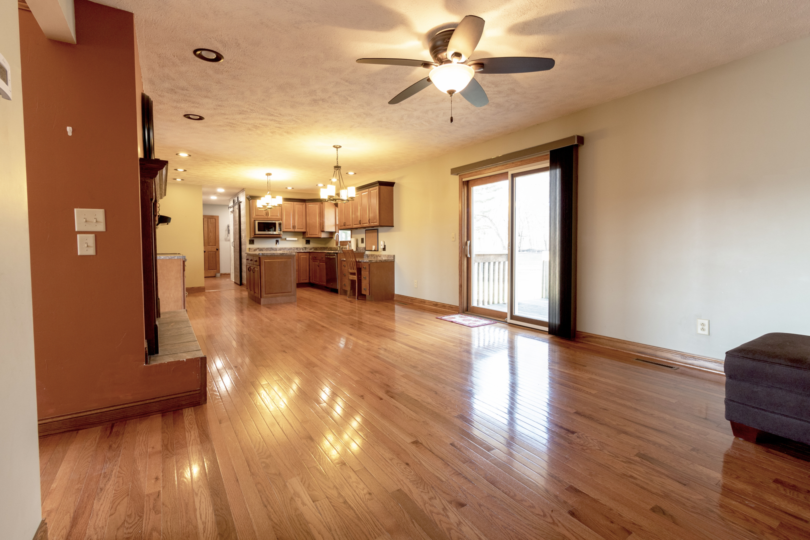 1455 North Gorham Road Morris, IL 60450 - Photo 4 of 22 a view of a livingroom with furniture a ceiling fan and wooden floor