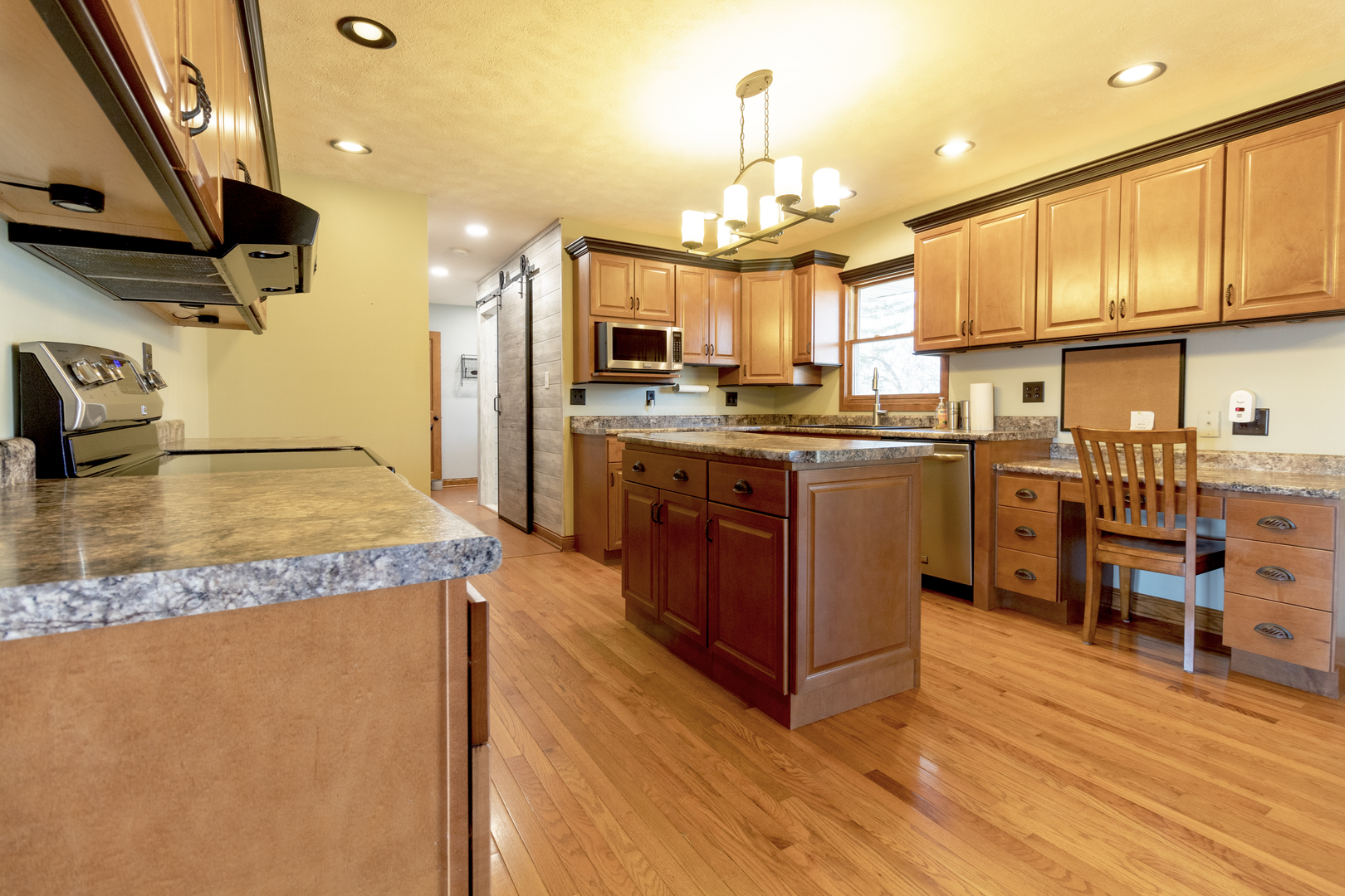 1455 North Gorham Road Morris, IL 60450 - Photo 6 of 22 a kitchen with stainless steel appliances granite countertop a sink a stove and a refrigerator
