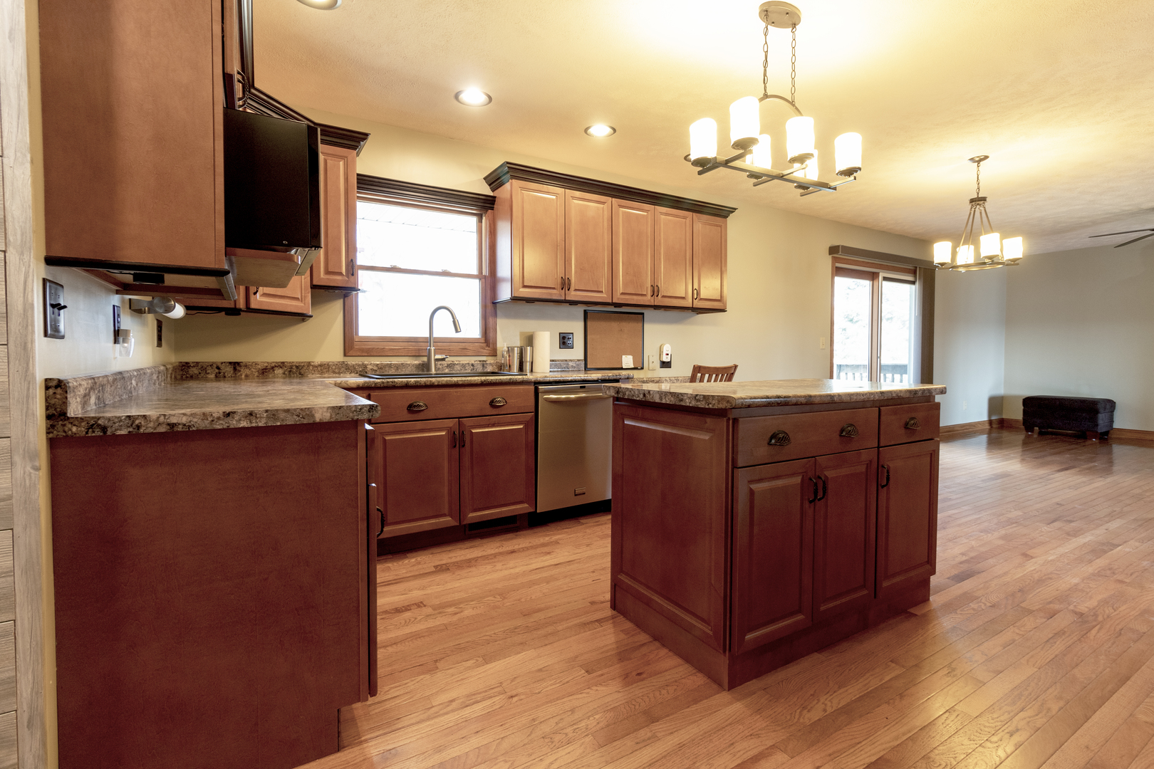 1455 North Gorham Road Morris, IL 60450 - Photo 8 of 22 a kitchen with stainless steel appliances granite countertop wooden cabinets a sink dishwasher a stove and a refrigerator with wooden floor