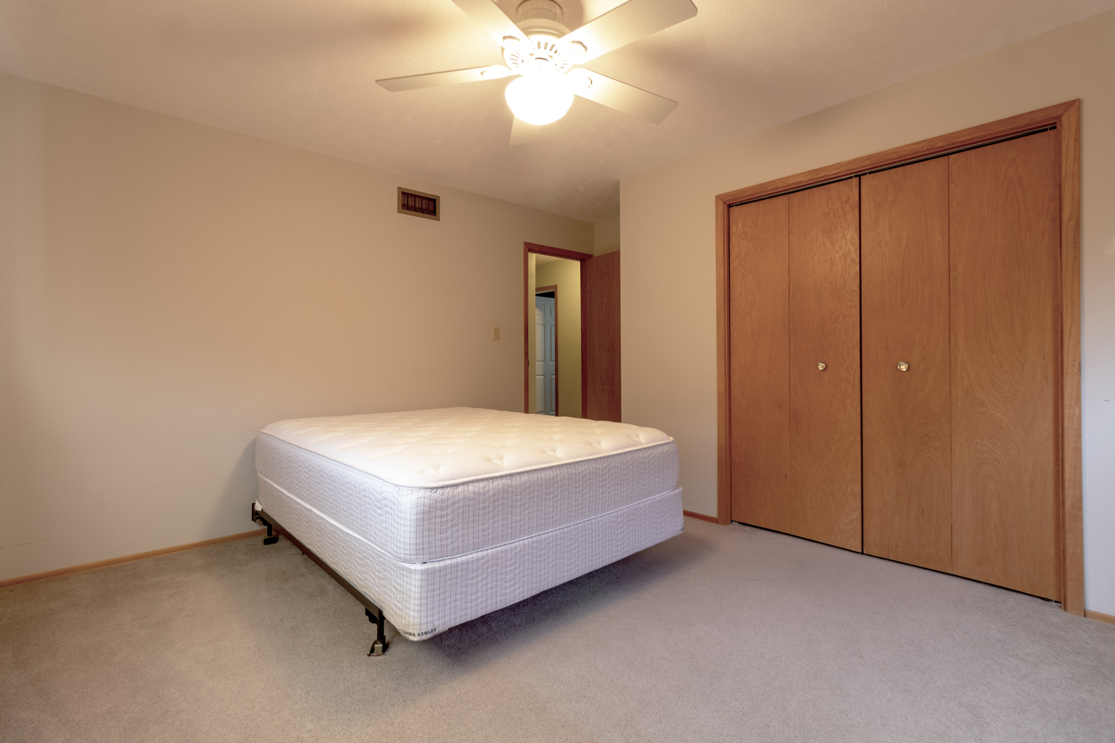 1455 North Gorham Road Morris, IL 60450 - Photo 10 of 22 a bedroom with a bed and a chandelier