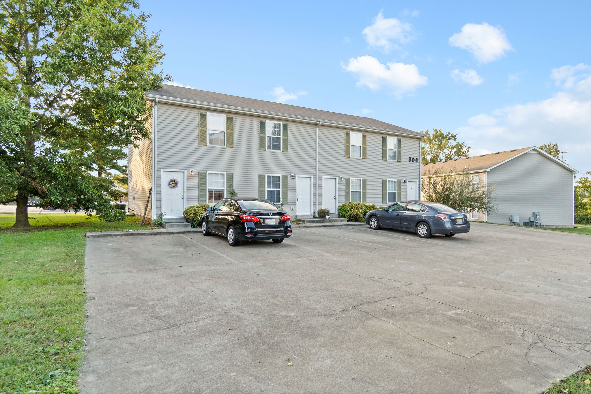 a view of a car parked in front of a house