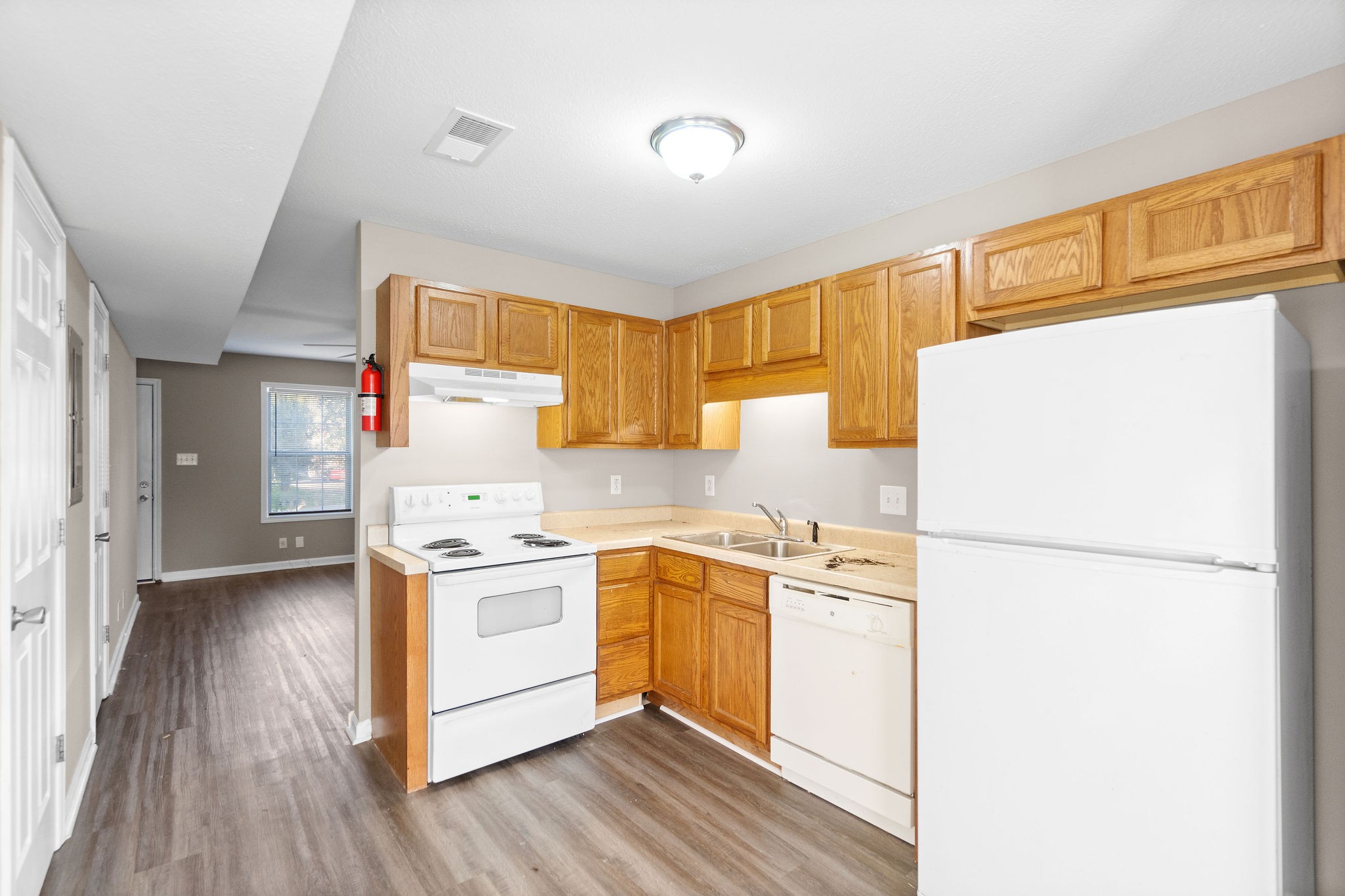 804 Golf View Place, Unit B Clarksville, TN 37043 - Photo 11 of 24 a kitchen with a white cabinets and white appliances