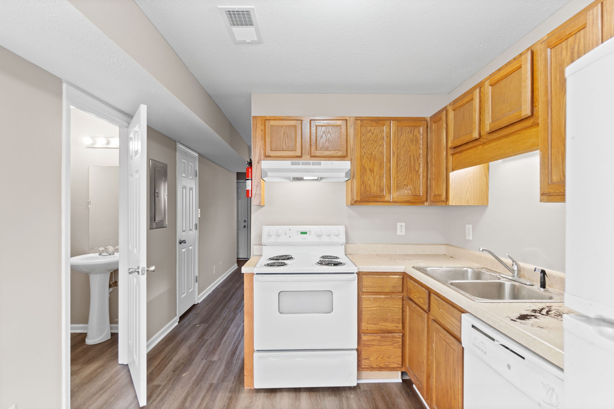 804 Golf View Place, Unit B Clarksville, TN 37043 - Photo 12 of 24 a kitchen with a sink a stove and cabinets