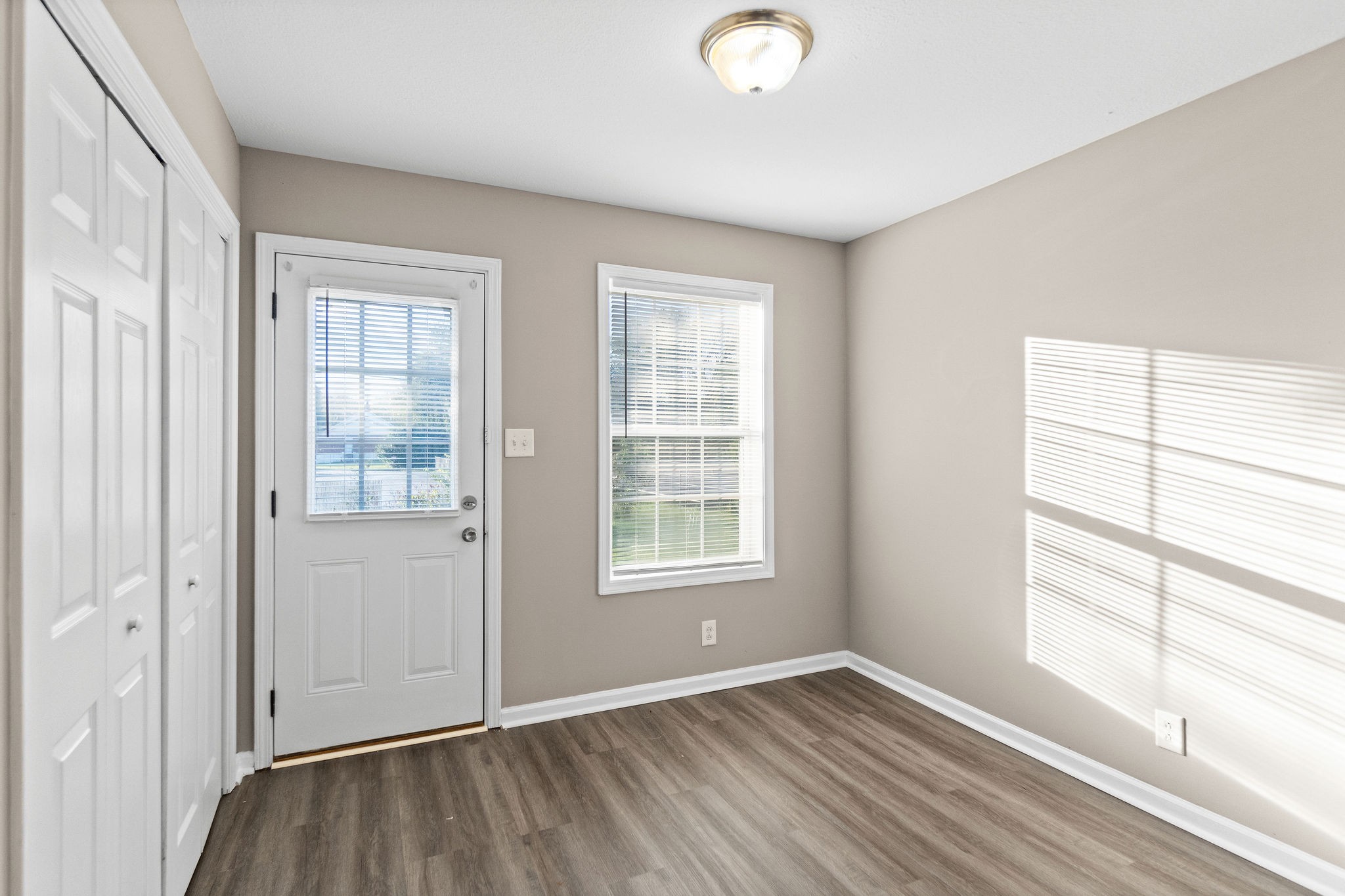 804 Golf View Place, Unit B Clarksville, TN 37043 - Photo 15 of 24 an empty room with wooden floor and windows