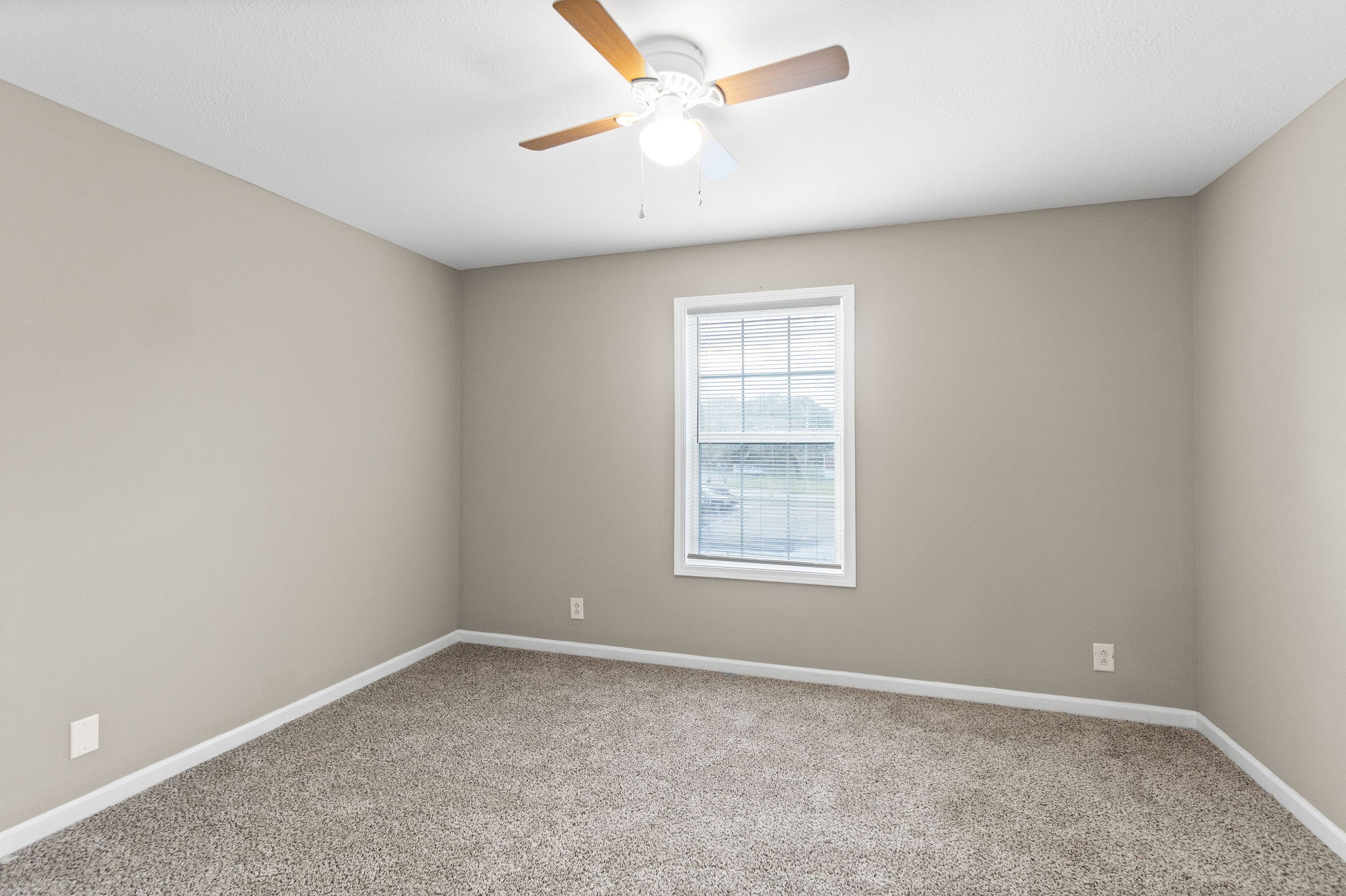 804 Golf View Place, Unit B Clarksville, TN 37043 - Photo 18 of 24 an empty room with a window and a fan