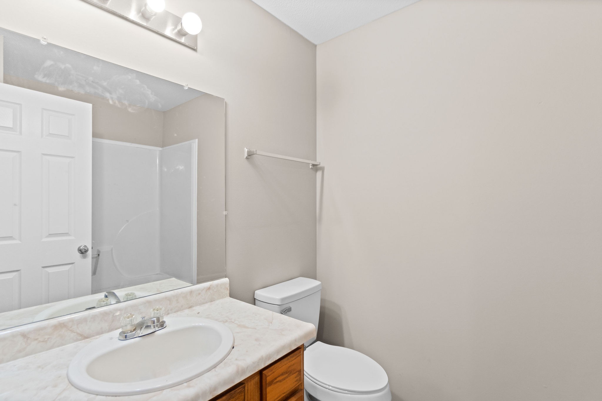 804 Golf View Place, Unit B Clarksville, TN 37043 - Photo 20 of 24 a bathroom with a sink a toilet and a mirror