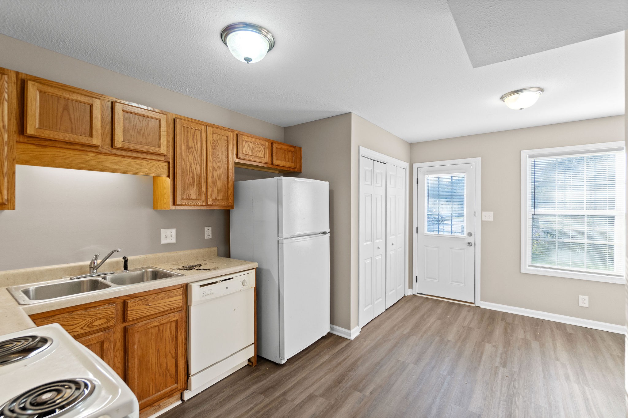 804 Golf View Place, Unit B Clarksville, TN 37043 - Photo 9 of 24 a kitchen with stainless steel appliances granite countertop a refrigerator and a sink