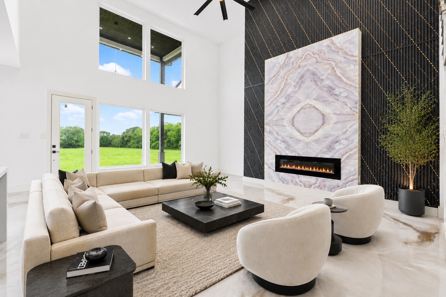 3237 Harkey Road Pearland, TX 77584 - Photo 5 of 46 *Virtually Staged*
Dramatic two-story living room showcasing a floor-to-ceiling designer fireplace feature wall, luxury marble-style flooring, and abundant natural light throughout.
