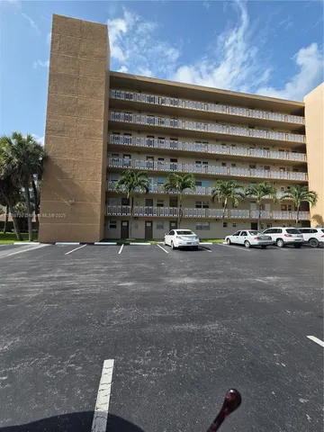 a view of parking with a bench